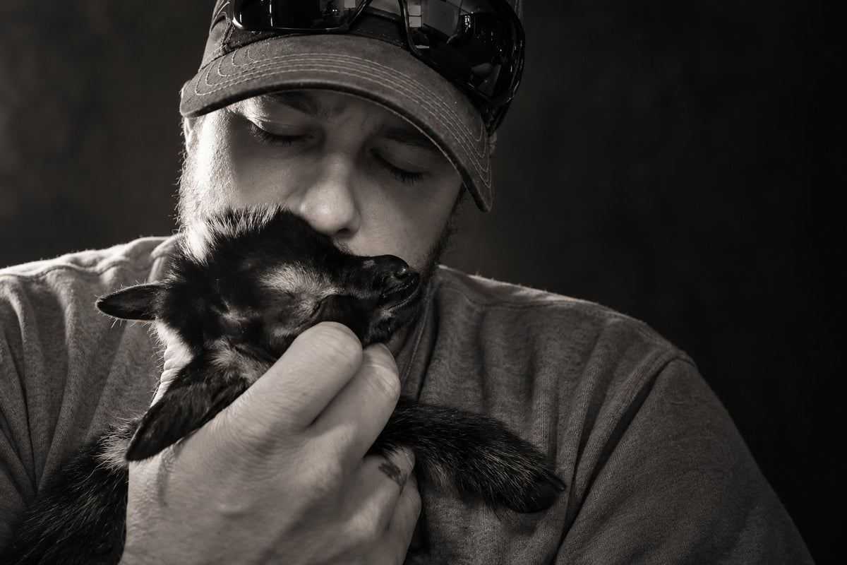 Justin holding baby Hope close in a black-and-white portrait